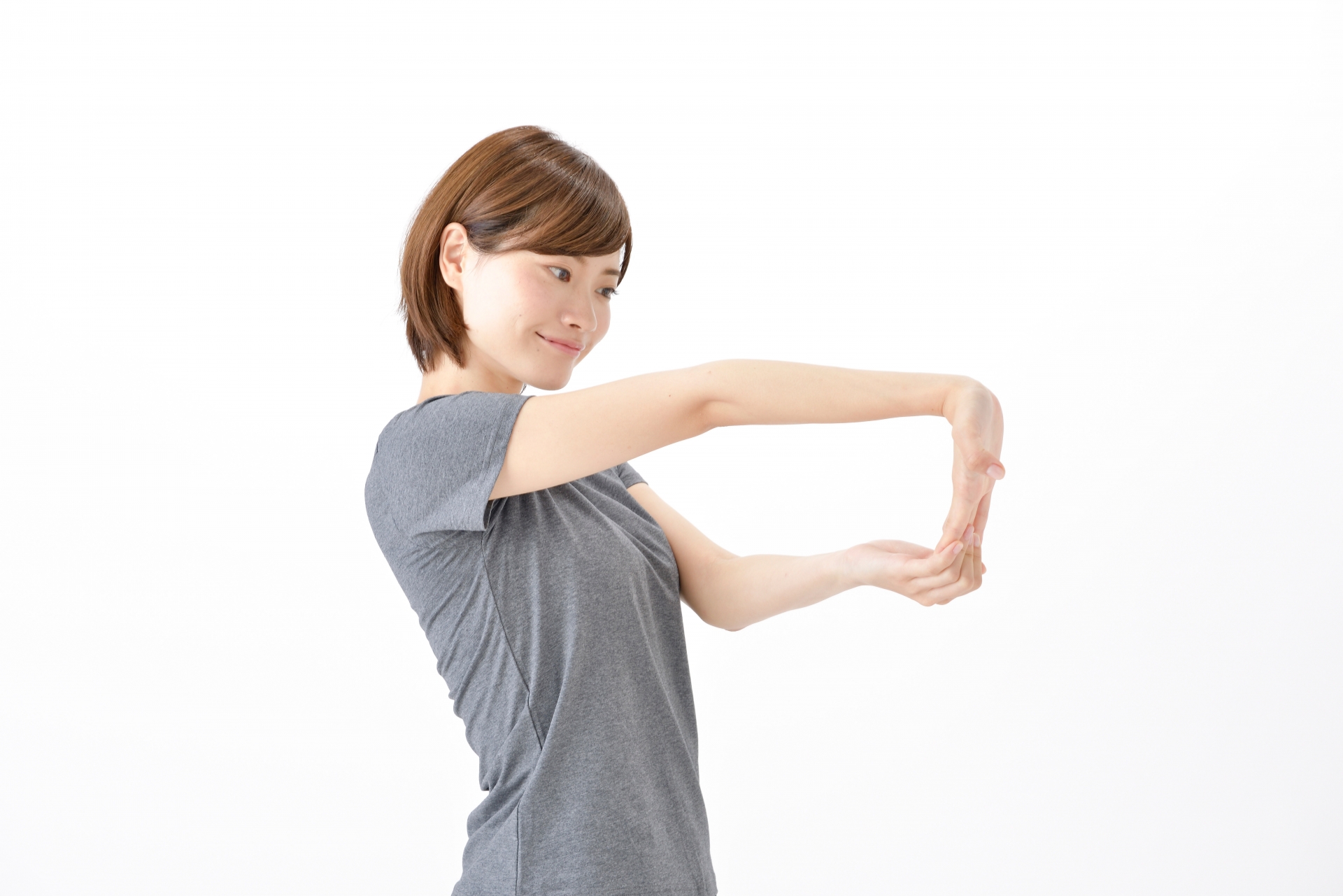 デスク環境と肘ストレッチの写真